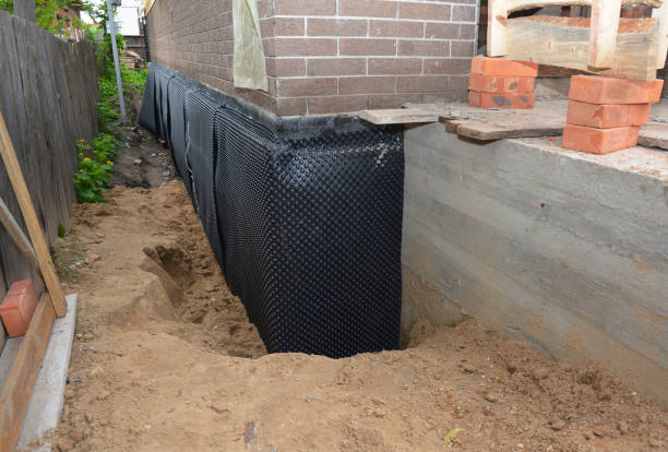 Happy homeowners after waterproofing job in Prairie Creek